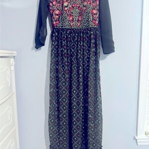 Party wears an Indian outfit with olive green with heavy work on a custom-made